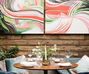 Place setting beneath painting